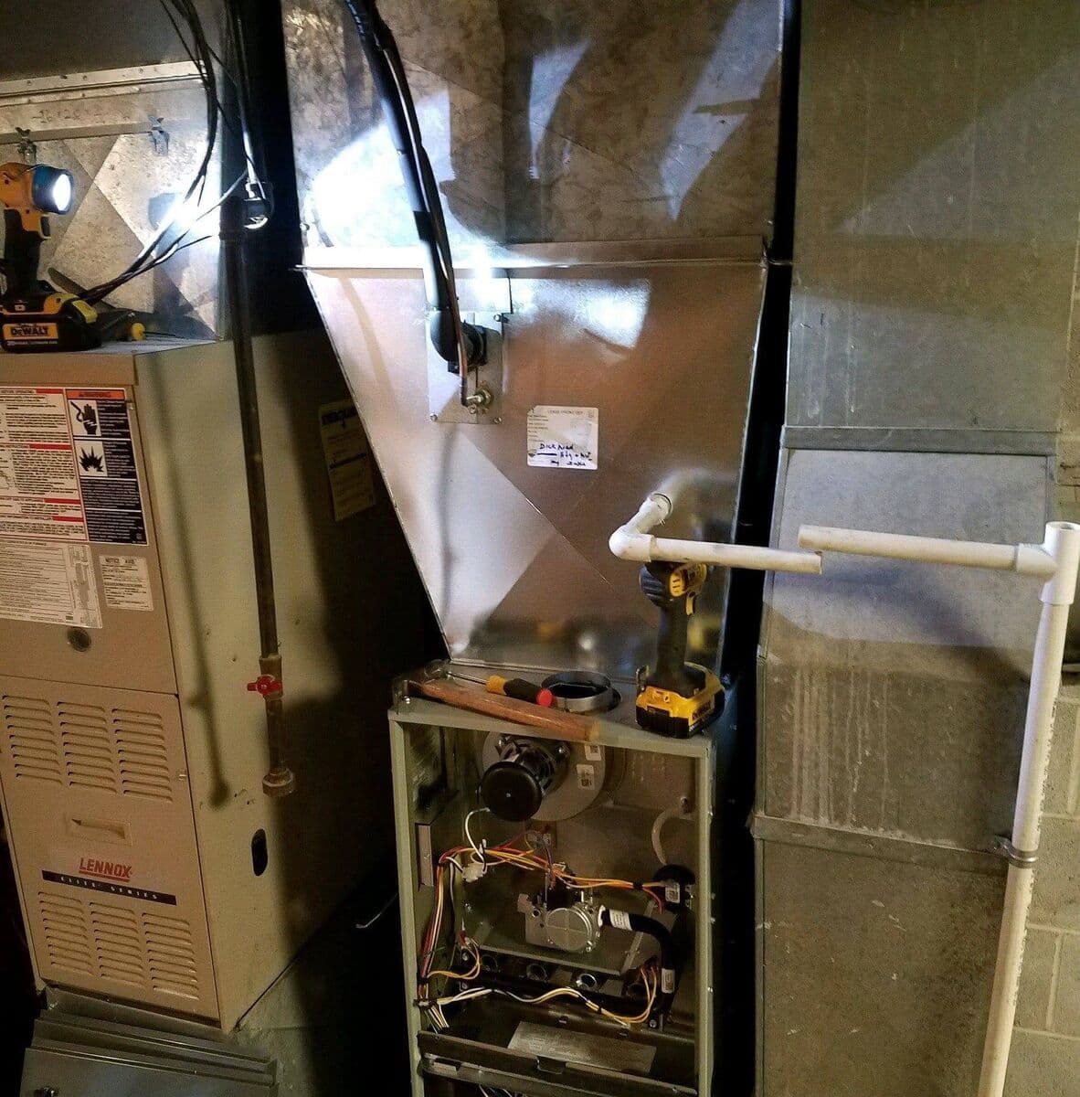 Gas furnace and sheet-metal ductwork in a residential basement