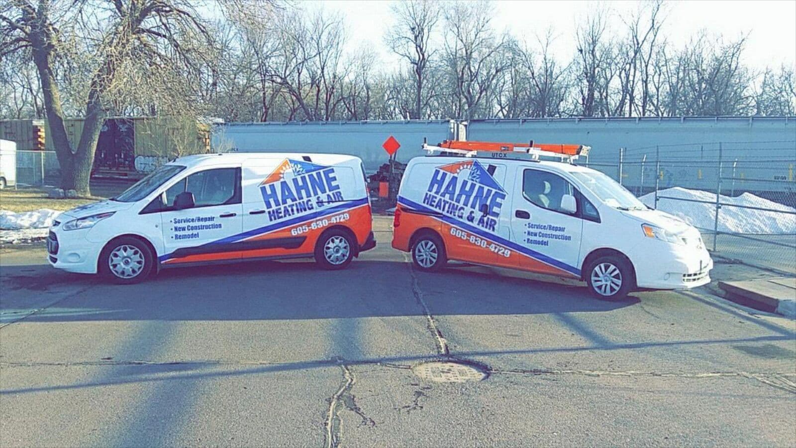 Our two branded Hahne Heating & Air service vans parked in Sioux Falls